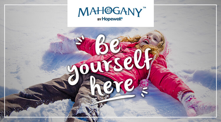 Text: Be yourself here. Image: girl making snow angel